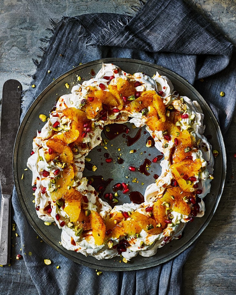 Negroni meringue pavlova wreath with pomegranate and pistachio