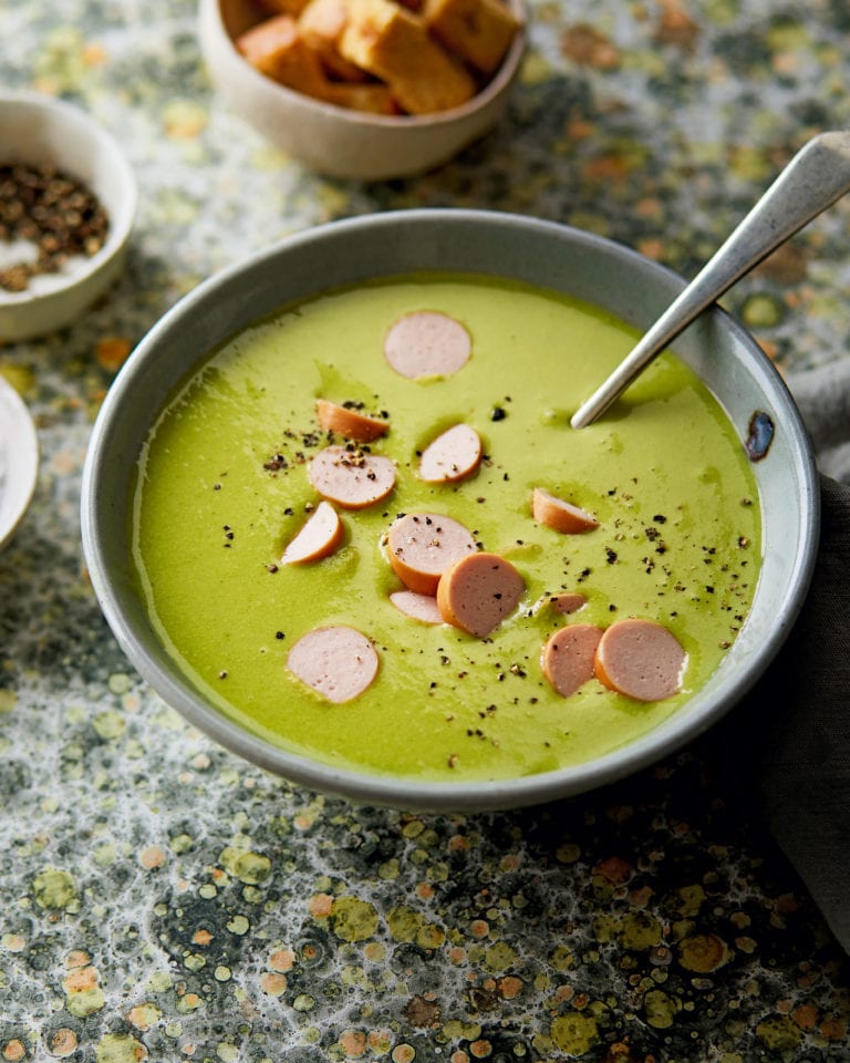Green pea soup with frankfurters