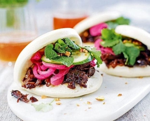 steamed buns with orange & pomegranate glazed lamb, quick-pickled red onion and pistachios