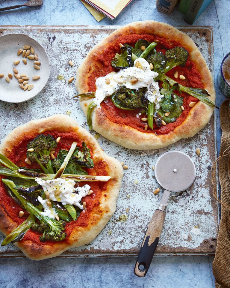 Pizzas with romesco sauce and greens