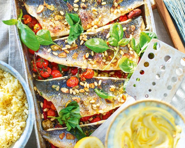 Sea bass traybake with peppers, cherry tomatoes and pine nuts