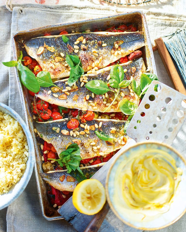 Sea bass traybake with peppers, cherry tomatoes and pine nuts