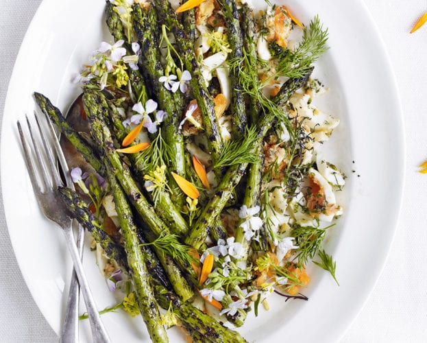 Barbecued asparagus with chopped eggs, tarragon, chives and dill