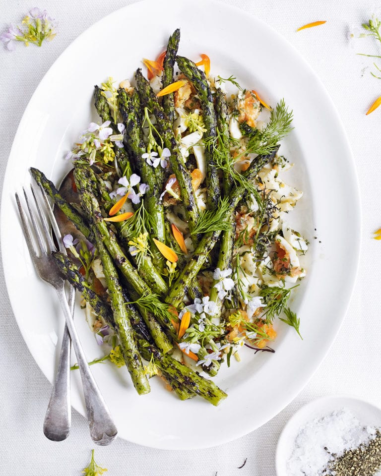 Barbecued asparagus with chopped eggs, tarragon, chives and dill