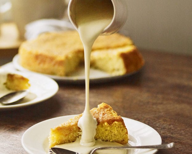 Sticky gooseberry cake with custard