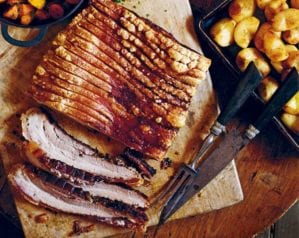 Slow-roasted pork with roasted apples and cider gravy