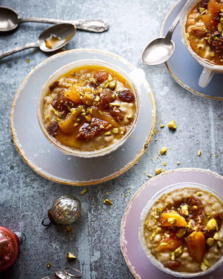 Rice pudding with honey soaked fruit and pistachios