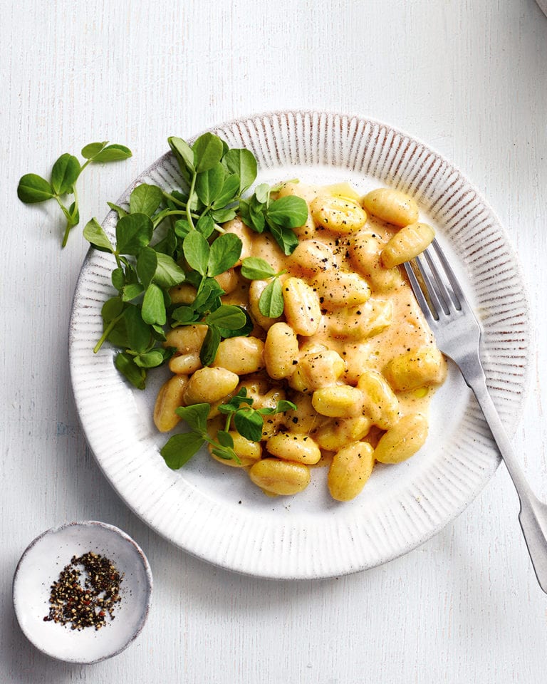 Cacio e pepe gnocchi with mint and pea shoots