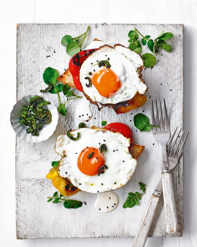 Fried eggs on toast with grilled peppers and aioli