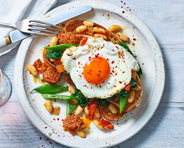 Beans and greens on toast with chorizo and egg