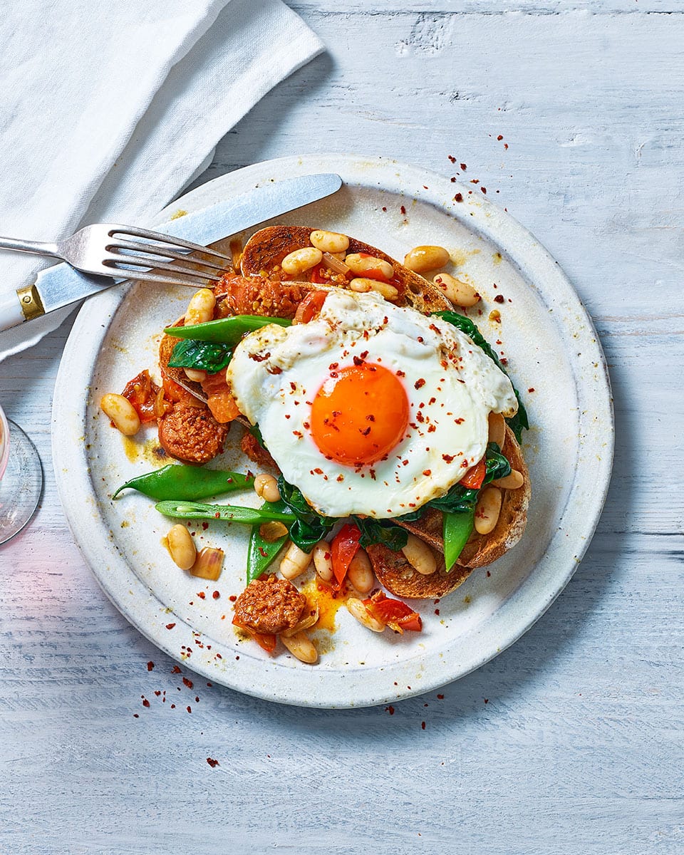Beans and greens on toast with chorizo and egg recipe | delicious. magazine
