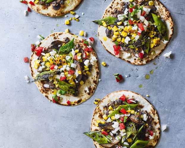 Crispy tacos with charred veg and refried beans