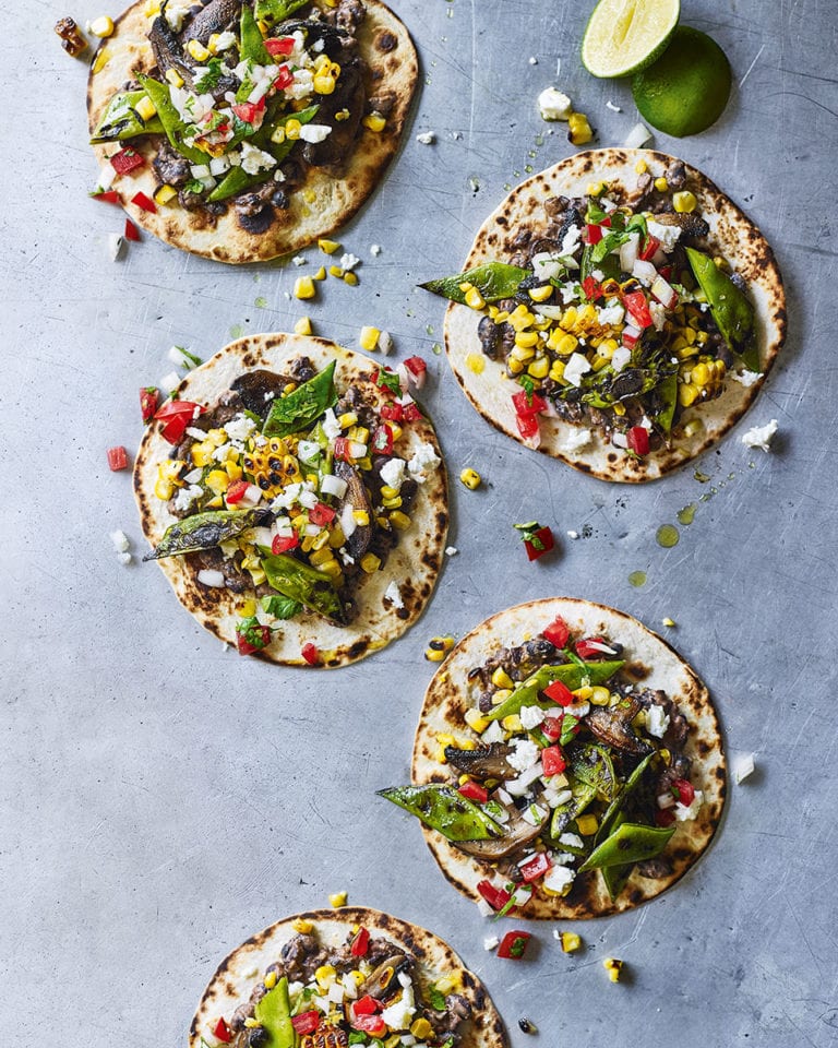 Crispy tacos with charred veg and refried beans