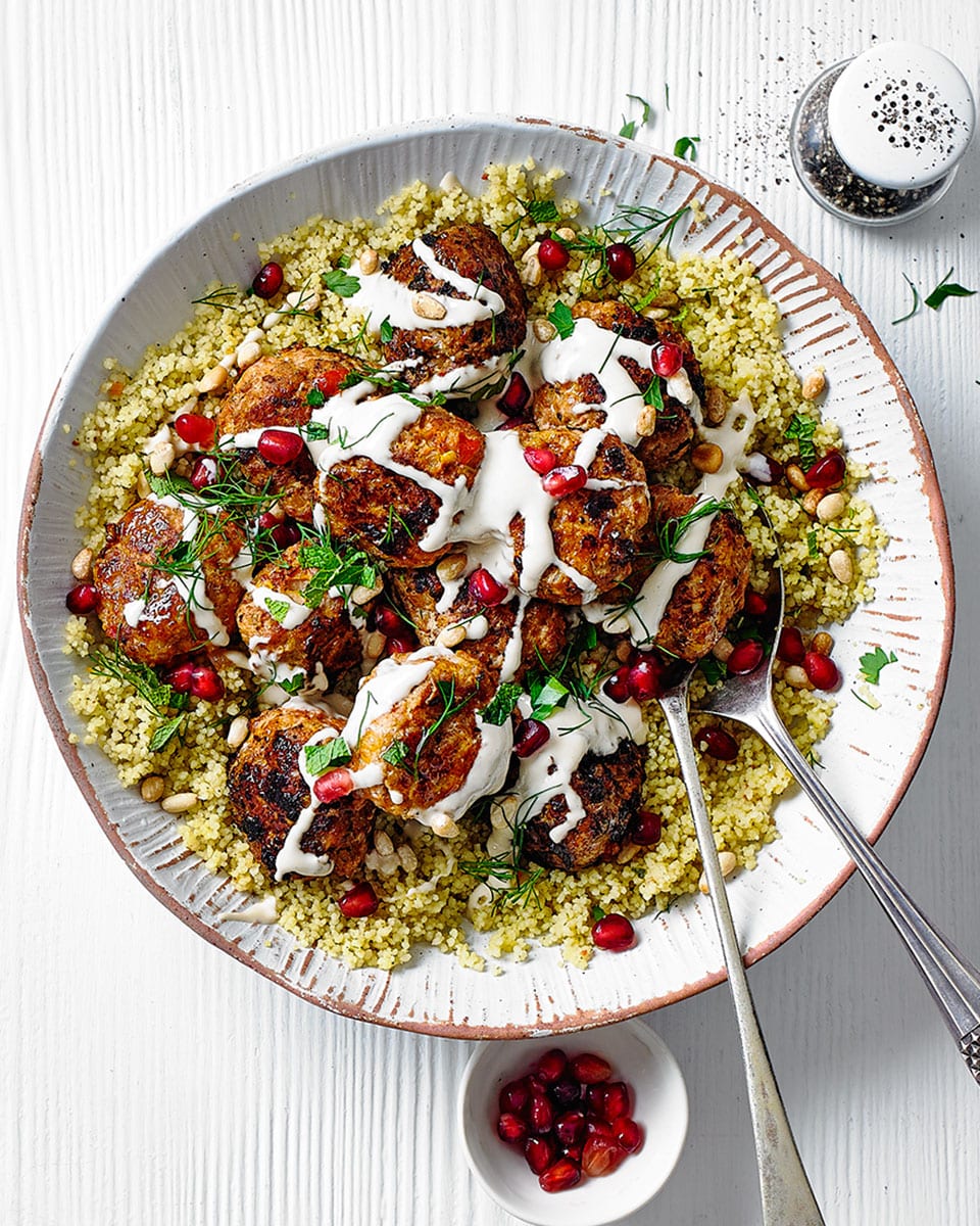 Harissa-spiced meatballs with houmous and pomegranate seeds recipe | delicious. Magazine