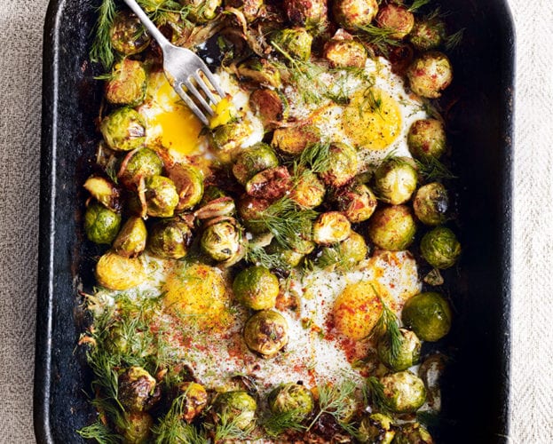 Roast brussels sprouts with caramelised onions and baked eggs