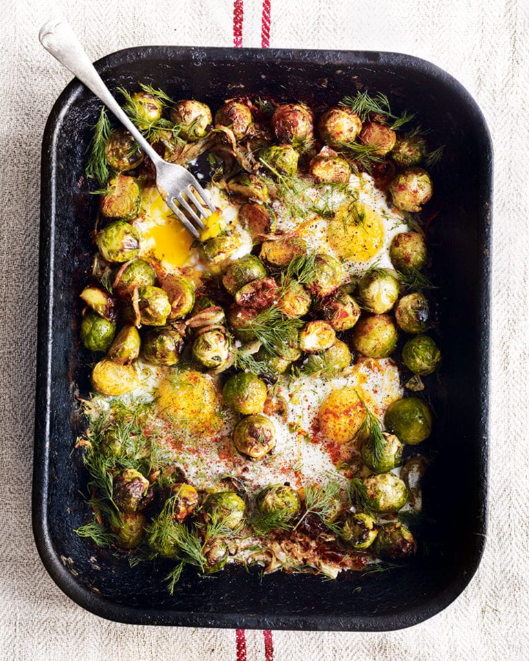 Roast brussels sprouts with caramelised onions and baked eggs