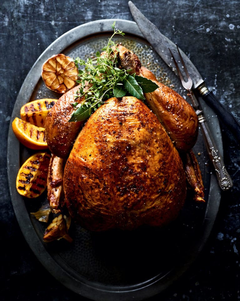 Brined and barbecue-roasted turkey with beetroot purée and tahini gravy