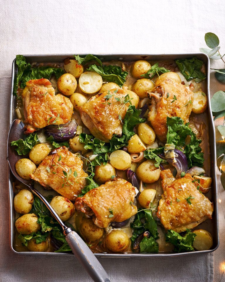 Roast chicken thighs with new potatoes and greens