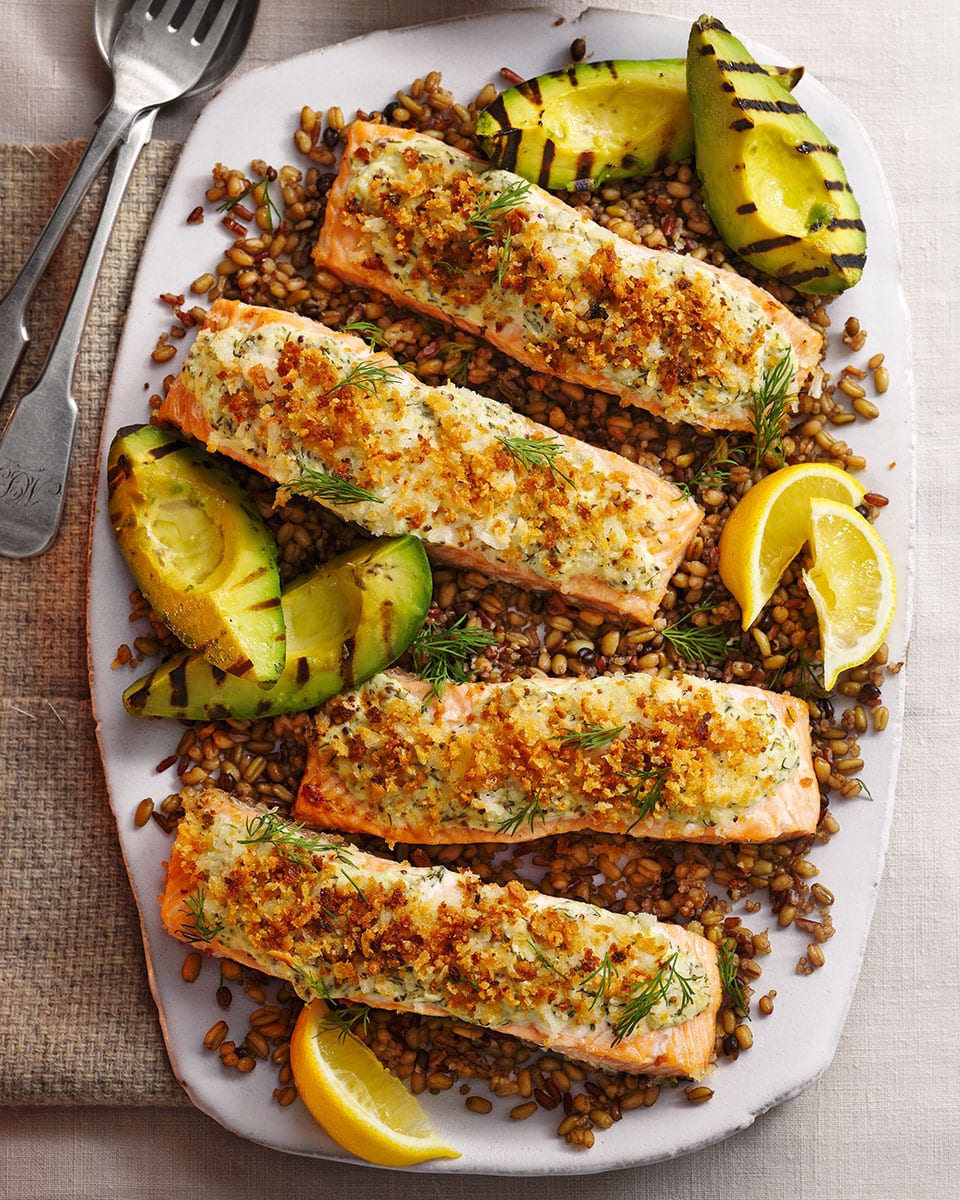 Herby crème fraîche salmon with grilled avocado recipe | delicious. Magazine