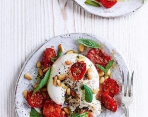 Burrata with sticky roasted tomatoes, pine nuts and basil
