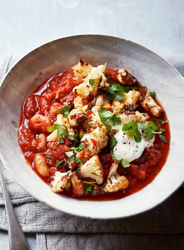 Spicy bean stew with crispy cauli topping