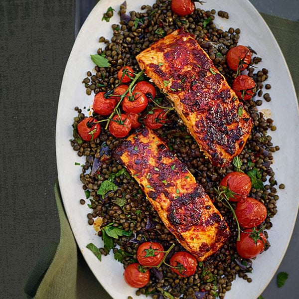 Harissa salmon with green lentils and roast cherry tomatoes