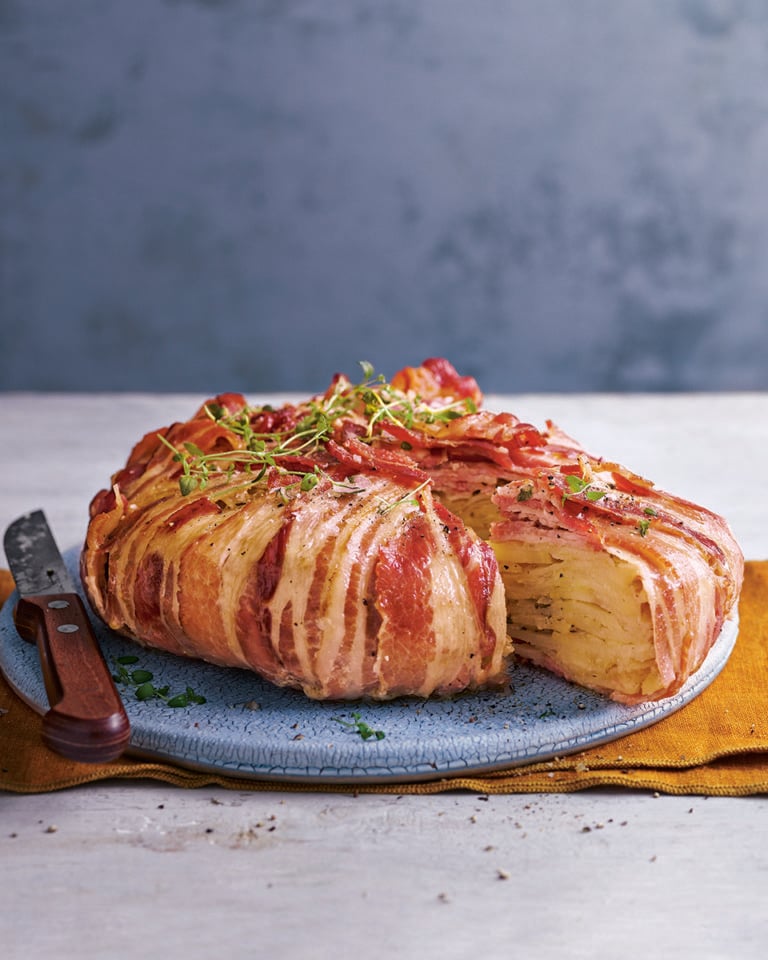Boulangère potatoes wrapped in streaky bacon