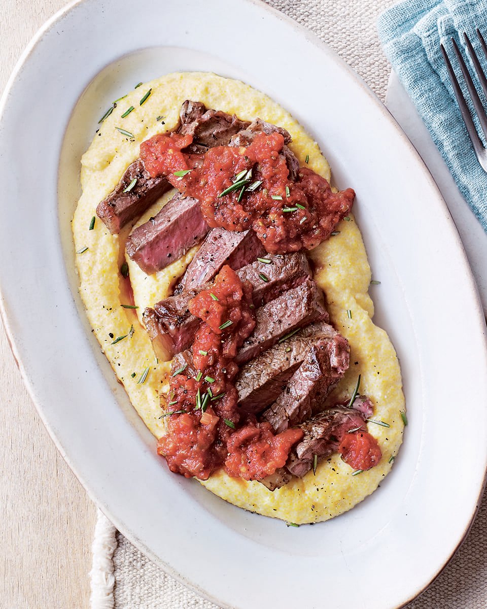 Steak with polenta and tomato and caper sauce delicious. magazine