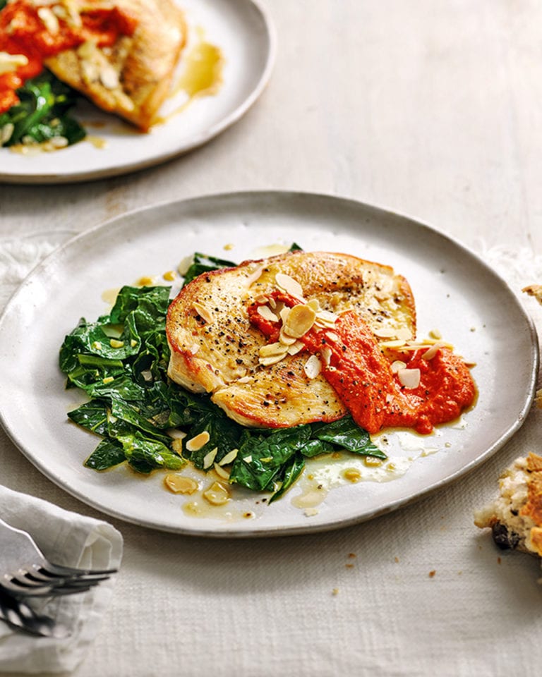 Chicken with smoky romesco sauce and garlicky greens