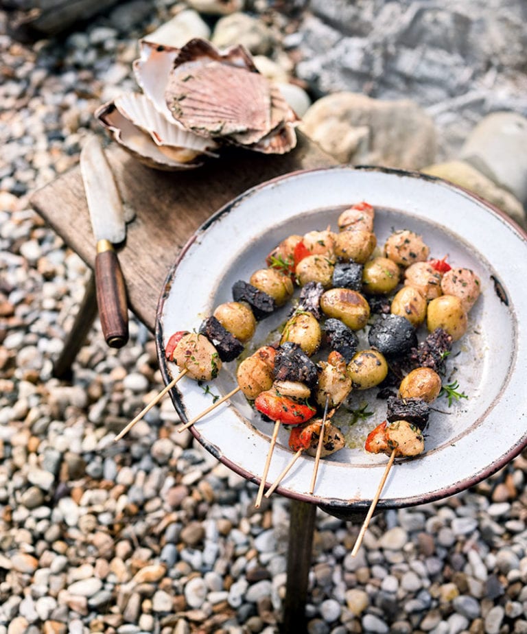 Barbecued new potato, morcilla sausage and scallop kebabs