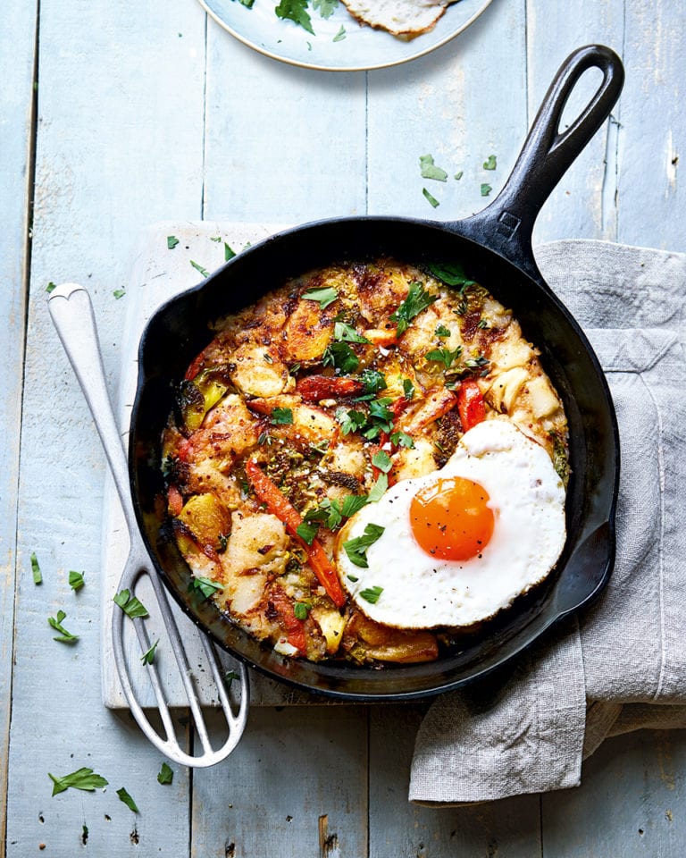 Veggie hash with fried eggs