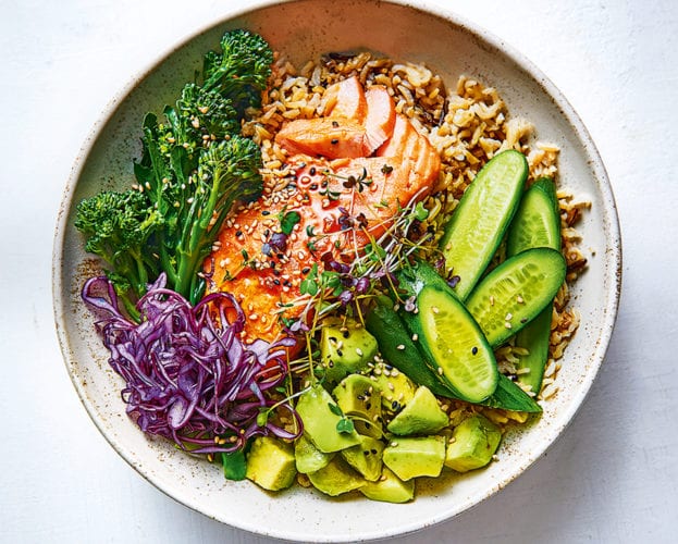Salmon and avocado rice bowl with soy and lemon dressing