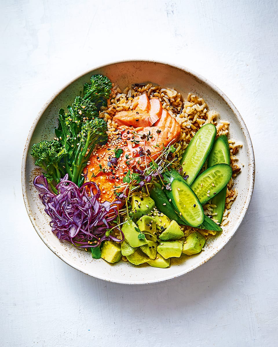Salmon and avocado rice bowl with soy and lemon dressing