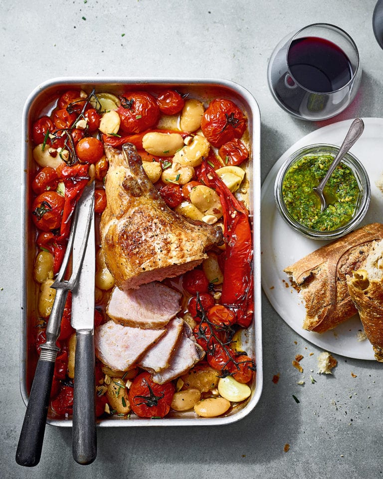 Ibérico pork loin with sherry roasted tomatoes, peppers and butter beans