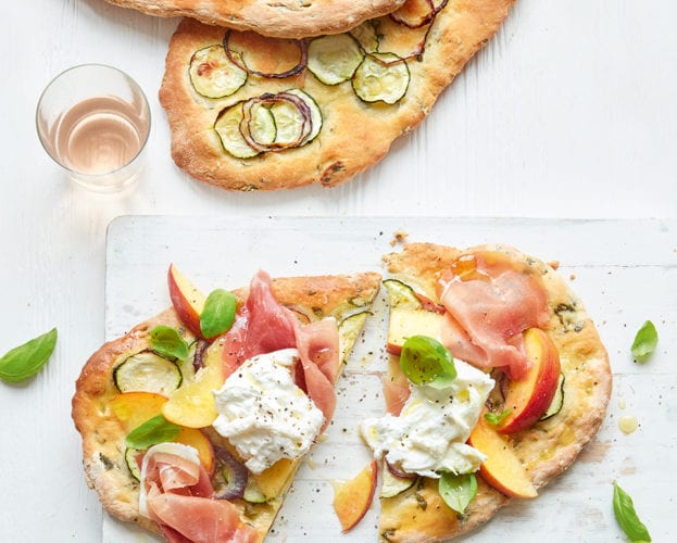 Courgette flatbreads with ham, peaches and burrata