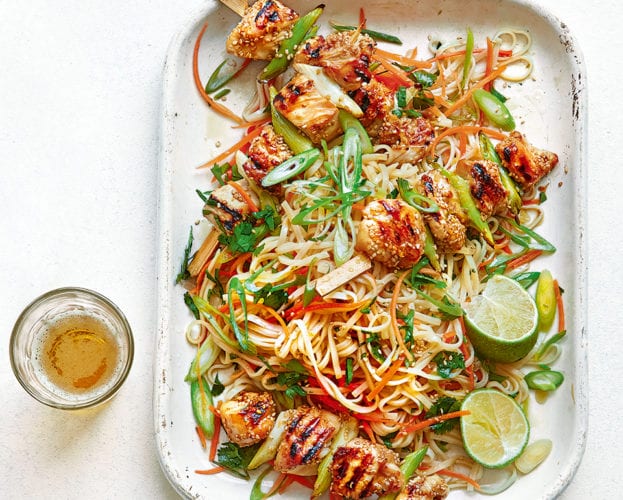 Sticky sesame chicken skewers with noodle salad