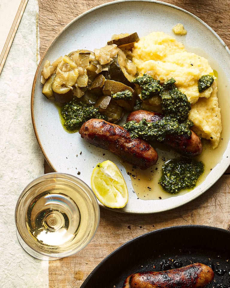 Sausages with polenta and braised courgettes