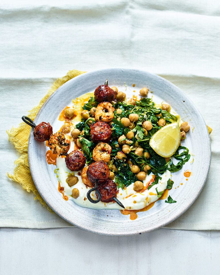 Prawn and chorizo skewers with yogurt, chickpeas and rocket