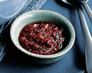 A small bowl containing harissa dressing