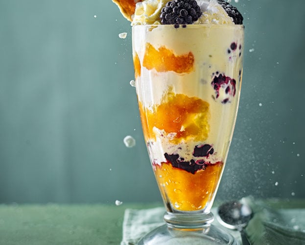 Peach and blackberry knickerbocker glory