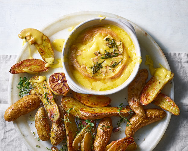 Baked baronet cheese with herbs and garlic roast potatoes