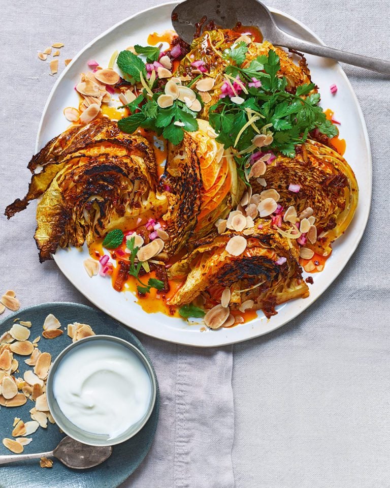 Charred cabbage with harissa butter and herb salad