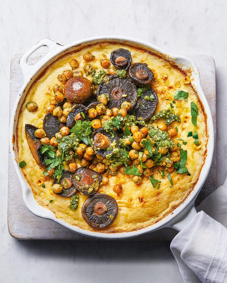Cheesy baked polenta with garlic butter, mushrooms and chickpeas