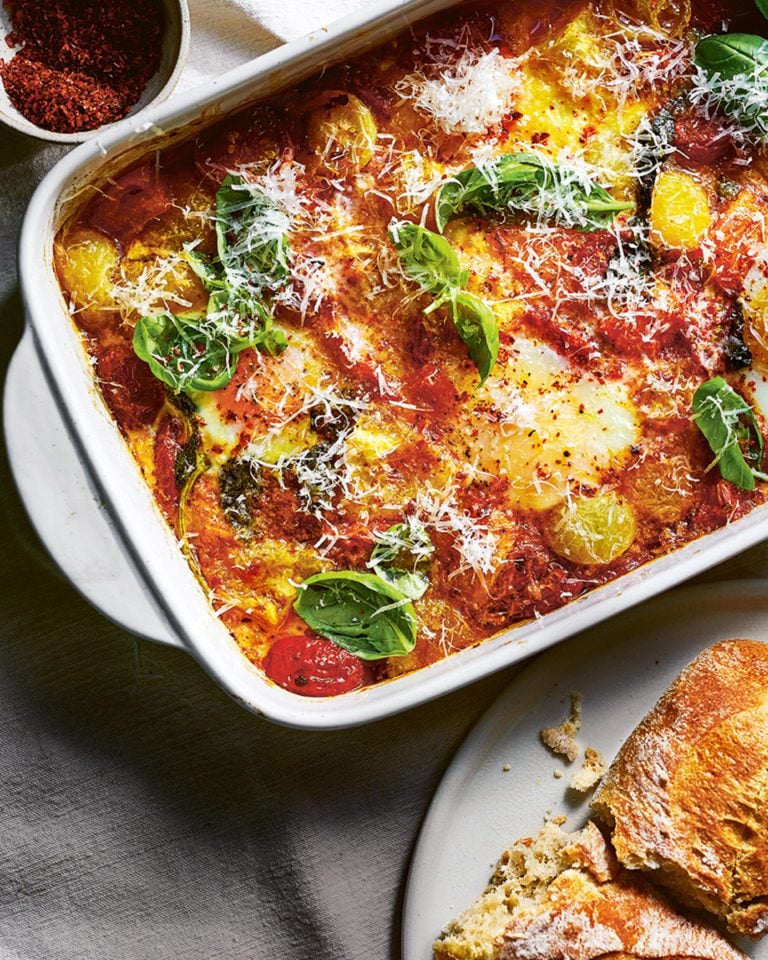 Baked tomatoes and eggs with basil, chilli and parmesan