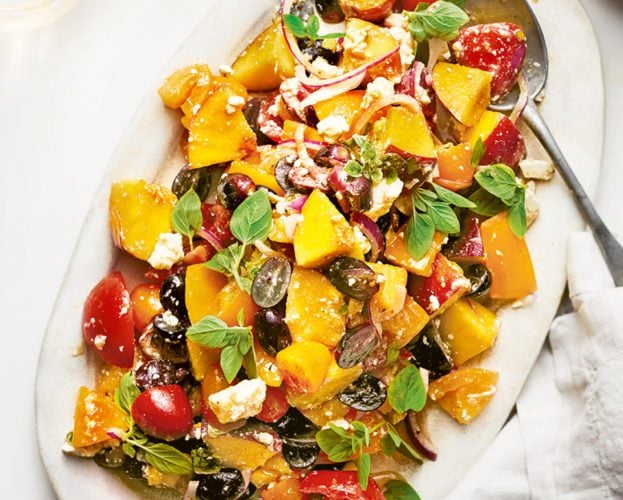 Tomatoes with peaches, grapes, feta and oregano