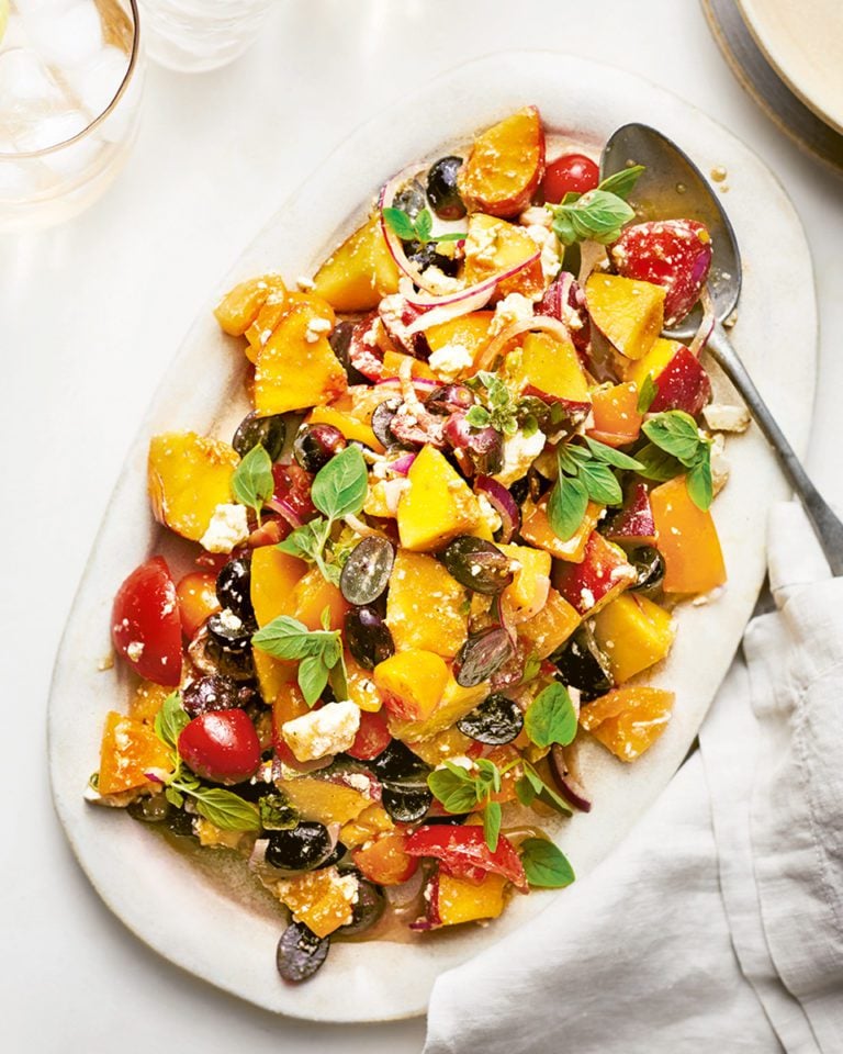 Tomatoes with peaches, grapes, feta and oregano