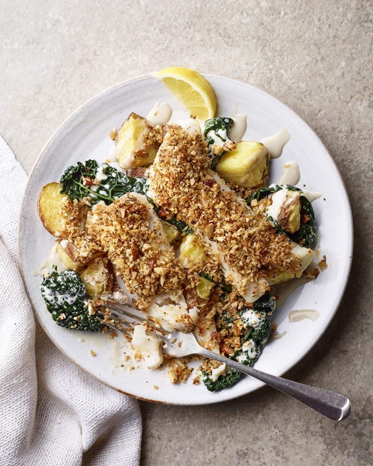 Almond-crusted pollock with tahini, potatoes and cavolo nero