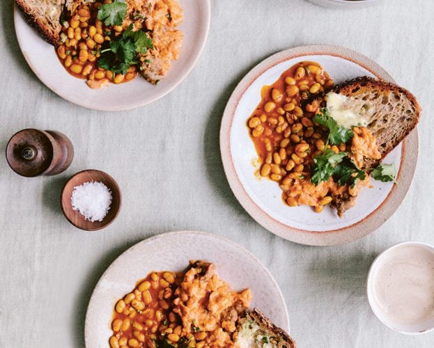 Spicy sausage scrambled eggs with tarka beans