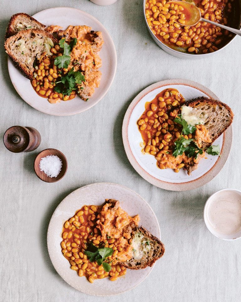 Spicy sausage scrambled eggs with tarka beans