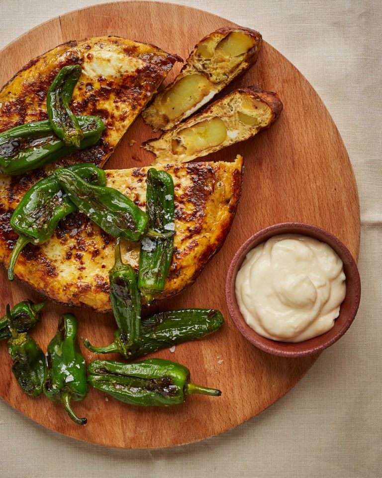 Jersey royal tortilla with aioli and padrón peppers